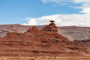 Fototapeta na wymiar Scenic view of the sombrero shaped rock formation of Mexican Hat on the San Juan River on the northern edge of the Navajo Nations borders in south central San Juan County, Utah, USA