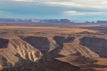 Fototapeta na wymiar Scenic aerial vistas of desert landscape and canyons of Valley of the Gods seen from remote cliff Muley Point near Mexican Hat, San Juan county, Utah, USA. Monument valley seen in the distance