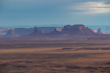 Scenic aerial vistas of desert landscape and canyons of Valley of the Gods seen from remote cliff Muley Point near Mexican Hat, San Juan county, Utah, USA. Monument valley seen in the distance