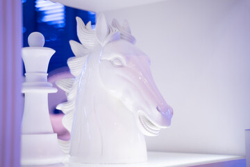 A white marble horse head carved on the show floor of a luxury hotel room
