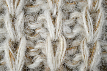 Grey, brown color wool knitted background closeup