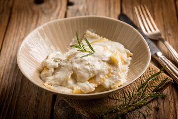 ravioli with parmesan cheese and herbs