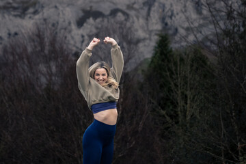 Golden Jubilation: A Blonde Beauty Leaps with Joy in the Enchanting Autumn Beech Forest