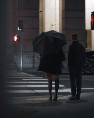 couple at traffic lights at night