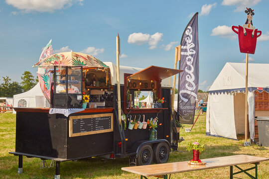 Decorative black food truck selling coffee drinks on a country fair in Aalten, The Netherlands on  June 23, 2023