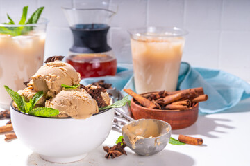 Spicy thai tea ice cream balls, asian indian masala spicy gelato with spices and mint, alternative vegan keto summer cold dessert with coconut cream and thai tea