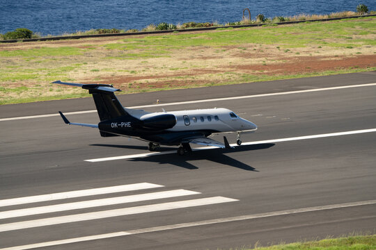 Funchal, Madeira - June 24, 2023: Embraer EMB-505 Phenom 300E (REG: OK-PHE) Takeoff at Funchal Airport (FNC)