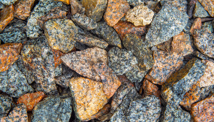 Stone background of angular gray-yellow stones