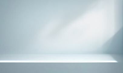 Minimal abstract light blue background for product presentation. Shadow and light from windows on...