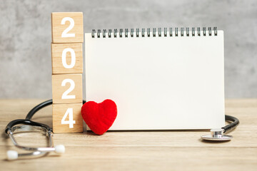2024 Happy New Year for healthcare, Insurance, Wellness and medical concept. Stethoscope and blank...