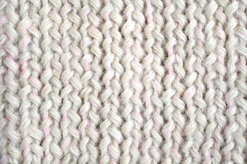 Grey, pink, white color wool knitted background close up