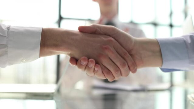 Business partnership meeting concept. Image businessmans handshake. Successful businessmen handshaking after good deal.