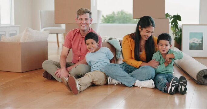 Happy family, real estate and moving in new home for mortgage loan, investment or property together. Portrait of father, mother and children smile with boxes in renovation or relocation for house