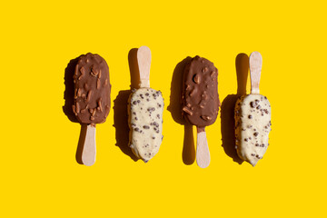 a closeup shot of a delicious ice cream on a yellow background