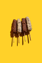 a closeup shot of a delicious ice cream on a yellow background