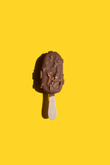 a closeup shot of a delicious ice cream on a yellow background