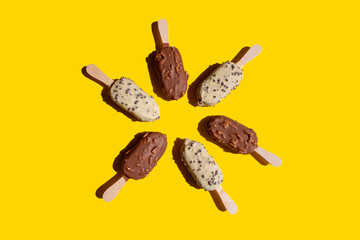 a closeup shot of a delicious ice cream on a yellow background