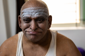 A South indian aged Fat Man with Funny face