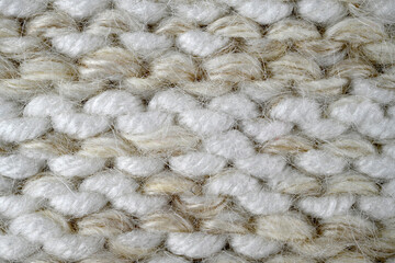 Grey, brown color wool knitted background closeup
