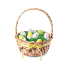 Wicker basket with beautifully painted Easter eggs isolated on white
