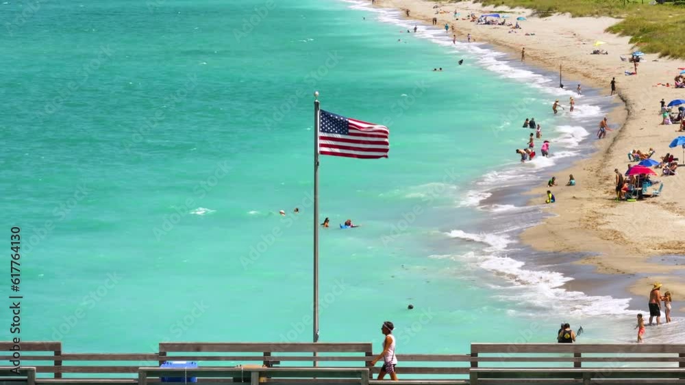 Canvas Prints Famous Venice fishing pier and sandy beach in Florida. Many people enjoing vacation time bathing in warm gulf water and tanning under hot sun