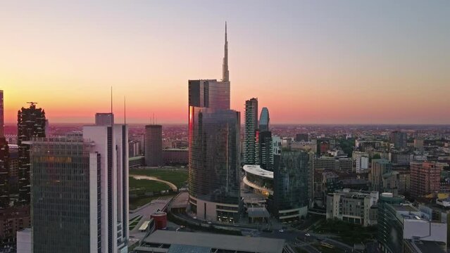 milan business city skyline seen through a window aerial view drone moving out from inside the room
