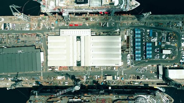 Aerial top down shot of two new cruise ships being built in the shipyard