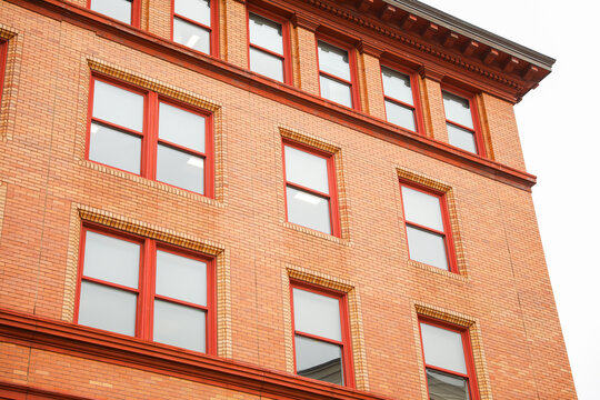 Iconic Brick Building Represents The Enduring Strength And Stability Of The Business Industry, Symbolizing The Passage Of Time And The Financial Success Achieved Through Resilience And Solid Foundatio