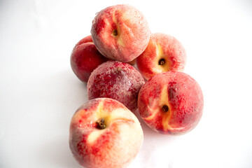 ripe peaches on a white background. top view. close up. fresh peaches in a bowl on a white background.