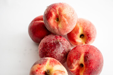 ripe peaches on a white background. top view. close up. fresh peaches in a bowl on a white background.