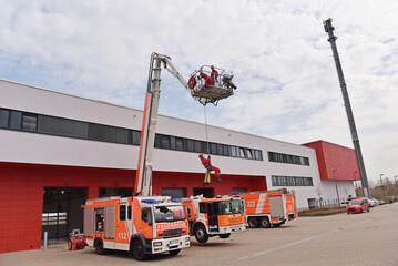 training in altitude rescue at the fire brigade - emergency operation with a crane trolley and...