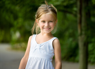 Fototapeta premium Portrait of a beautiful liitle girl close-up