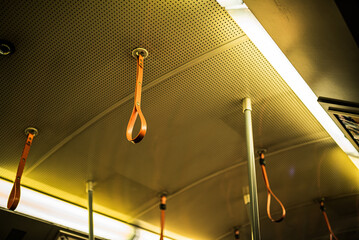 Yellow handles in an underground train in Vienna
