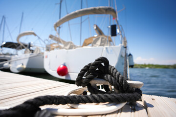 Nautical marine knot used to park a boat in a pier harbour. Sailing and boats concept image. 