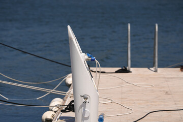 Electrical power outlet on a ship harbour bay. Photo with the electricity outlets used for parked ships and yachts at the sea side marina.