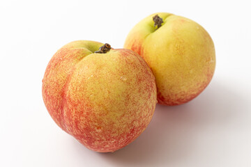 white peaches without hairs on a white background