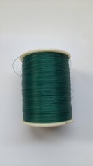 top view of kenur thread on a white background. nylon background concept, business, texture, fabric, yarn, motif, tie, bond, industry, industrial, cotton, material, textile, garment, pattern,lifestyle