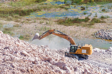 The Excavator Works in a Stone Quarry