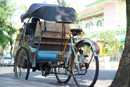 Becak, traditional transportation in Indonesia. (Beca, Betjak, Betja or Beetja). A popular means of transportation in ancient times. Yogyakarta, Indonesia - 05 May 2023