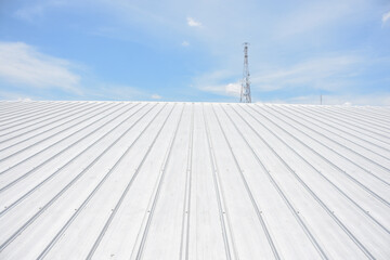 metal sheet roofing on commercial construction with blue sky