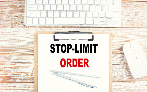 STOP-LIMIT ORDER text on a clipboard on wooden background
