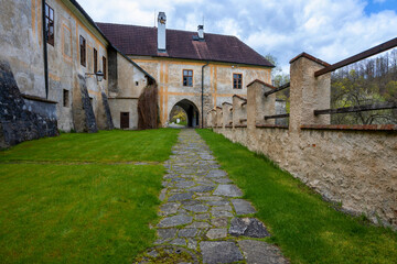 Fototapeta na wymiar Part of monastery Zlata Koruna, building, backyard and gate.
