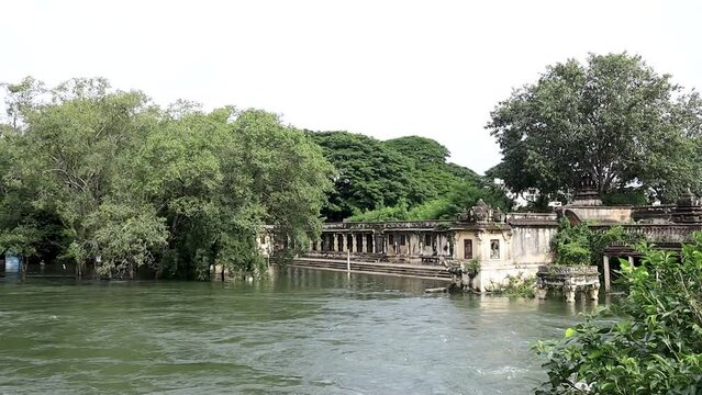 An Ancient ruined Hindu temple dedicated to Lord Ranganatha on the banks of river Cauvery where the water is flooding in Srirangapatna near Mysore in India.
