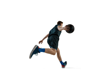 Bottom view image of young man, athlete running with ball, playing basketball isolated against white background. Concept of sport, action and motion, health, game, hobby, sportswear, ad