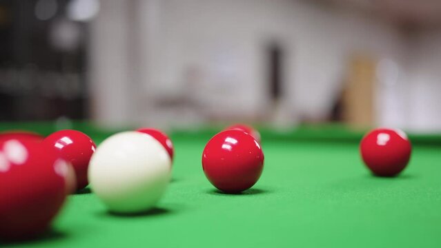 Close up of Snooker shooting on snooker table and balls in slow motion