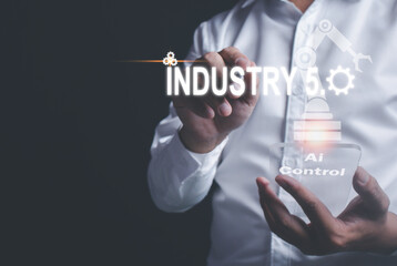 Businessman touching an icon with a pen The 5th Industrial Revolution, the concept of production process development between humans Intelligent systems and robots