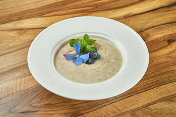 Oatmeal with blueberries and strawberries in a plate