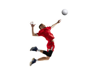 Dynamic image of young sportive man, professional volleyball player in red uniform in motion, hitting ball on white studio background. Concept of sport, active lifestyle, health, dynamics, game, ad