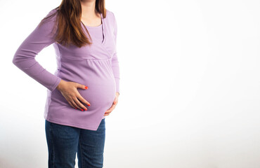 Pain and indigestion in a pregnant girl on a white background. The concept of diseases of the...