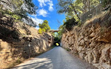 Arch at the beginning of the route of the old railway line, Vía Verde del Mar (Greenway of the...